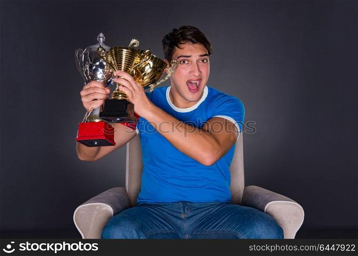 Man watching sports on gray background