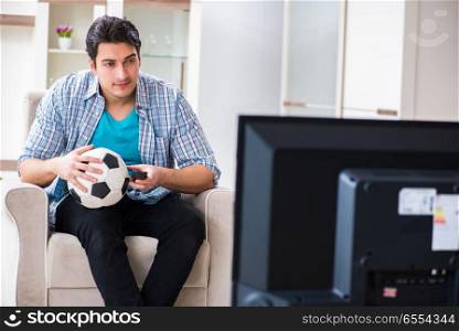 Man watching tv at home