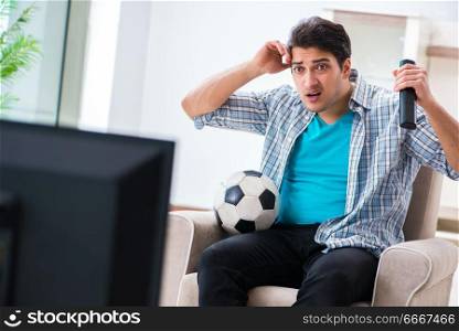 Man watching tv at home