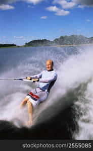 Man waterskiing barefoot