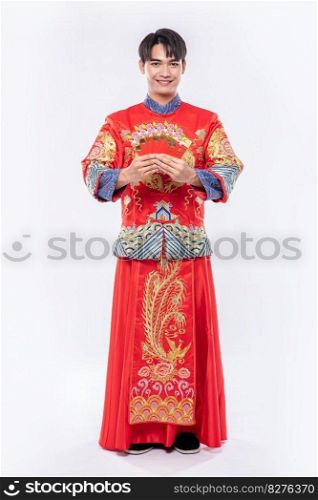 Man wear Cheongsam is very lucky to get gift money from parents in traditional day