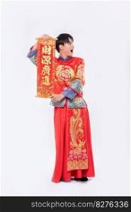 Man wear Cheongsam suit and wear black shoe give family the chinese greeting card for luck in chinese new year