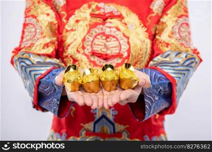 Man wear Cheongsam suit  give gold to his relative for lucky in chinese new year