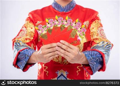 Man wear Cheongsam suit gives his family a gift To be a lucky person in the Chinese New Year