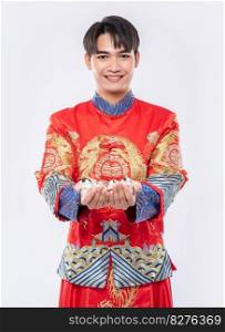 Man wear Cheongsam suit smile and standing to give the gift money to his family
