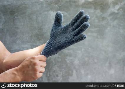man wearing a gray glove.