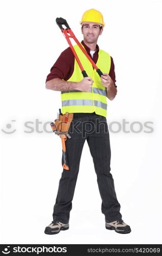 Man wearing a hard hat and holding large clippers
