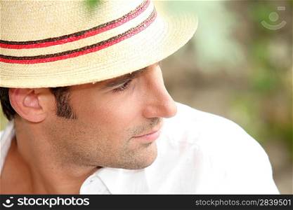 Man wearing a straw hat