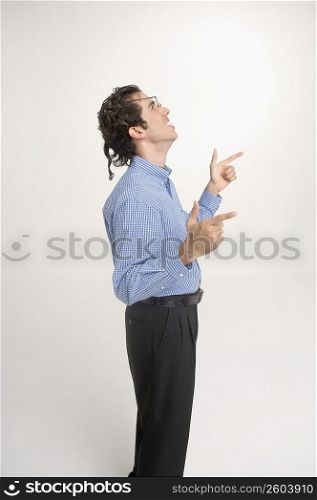 Man wearing crooked glasses gesturing