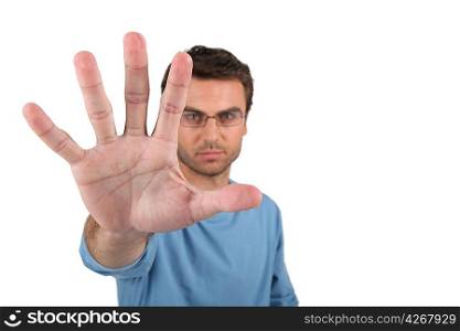 Man wearing glasses with arm stretched