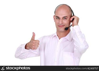 Man wearing headphones giving the thumb&acute;s up