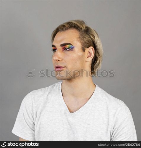 man wearing make up cosmetics looking away