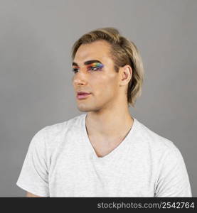 man wearing make up cosmetics looking away