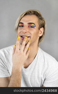 man wearing make up cosmetics nail polish front view