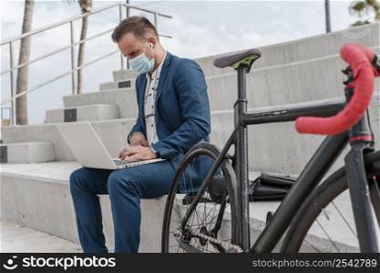 man wearing medical mask while sitting his bike 3