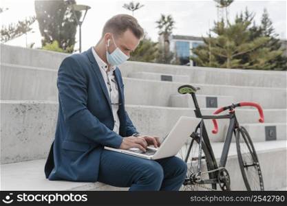 man wearing medical mask while sitting his bike 4