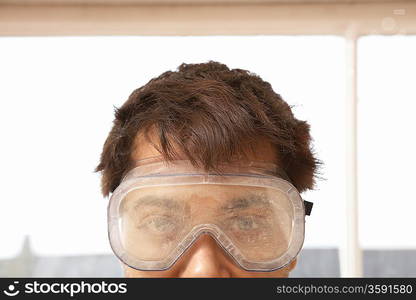 Man Wearing Protective Eye Goggles