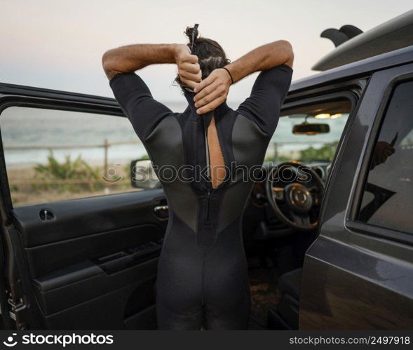 man wearing surfer clothes horizontal shot