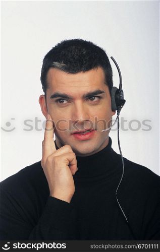 man wearing telephone headset