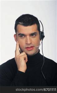 man wearing telephone headset
