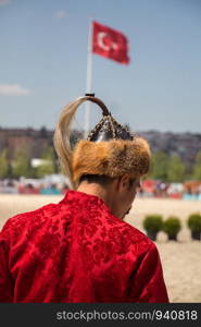 Man wearing traditional turkish hat in the view