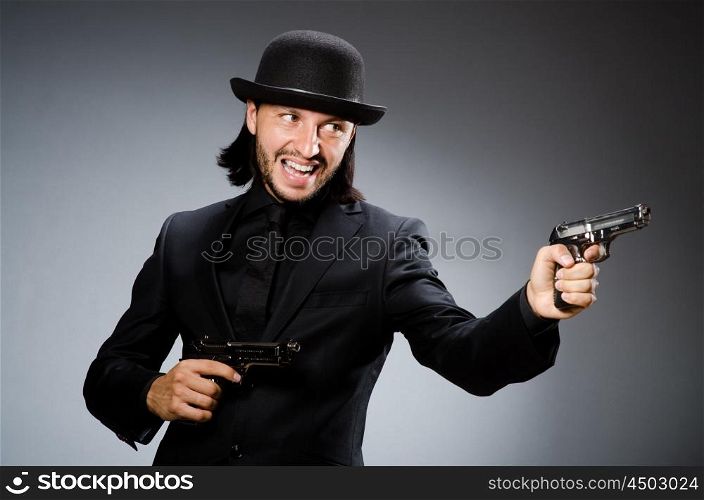 Man wearing vintage hat with gun