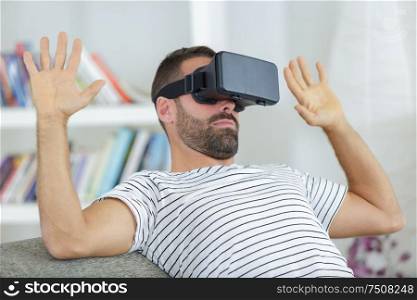 man wearing virtual mask stretching hands and
