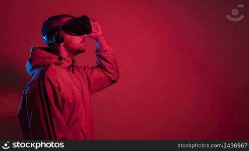man wearing virtual reality gadget with copy space