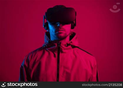 man wearing virtual reality gadget with red light