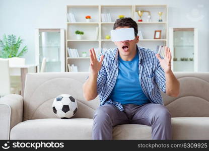 Man wearing virtual reality VR glasses watching soccer football