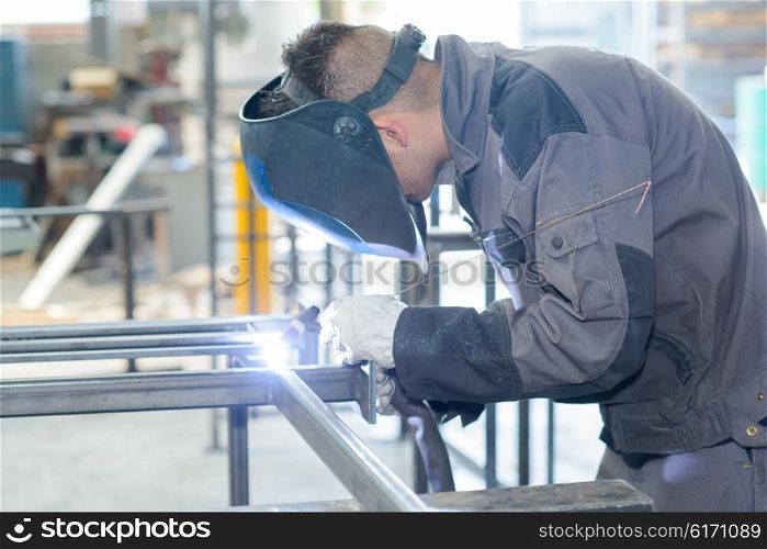 man welding