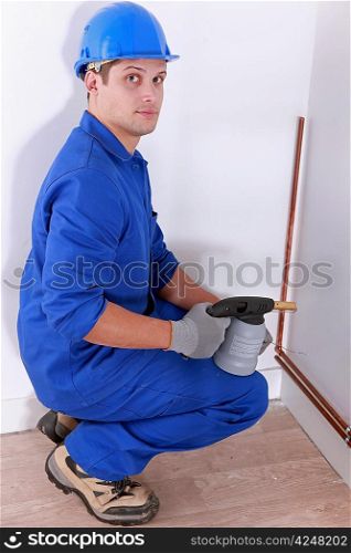 Man welding pipe