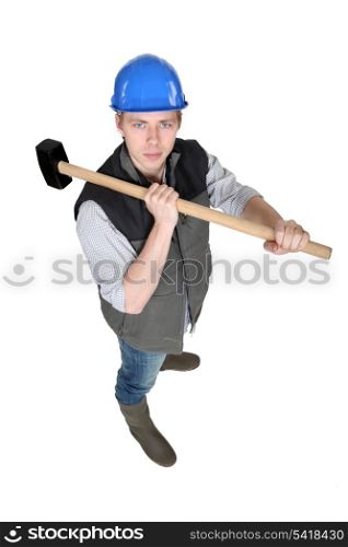 Man wielding heavy hammer