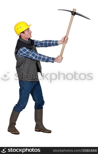 Man wielding pick-axe