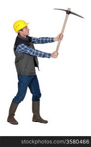 Man wielding pick-axe