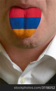 man wit open mouth spreading tongue colored in armenia flag as symbol of values like teaching, learning, multilingual speaking of different languages