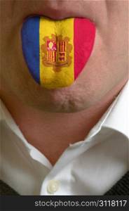 man wit open mouth spreading tongue colored in moldova flag as symbol of values like teaching, learning, multilingual speaking of different languages