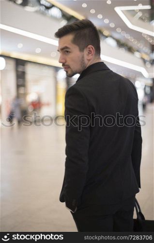 man with a bag goes to the airport