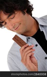 Man with a bar of chocolate