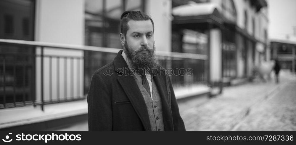 man with a beard is a black and white photo