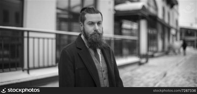 man with a beard is a black and white photo