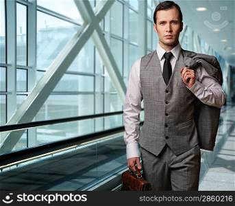 Man with a briefcase in an airport.