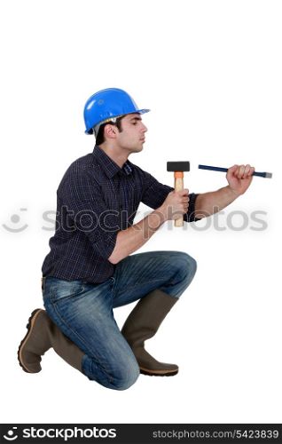 Man with a hammer and chisel