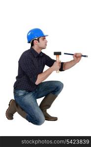 Man with a hammer and chisel