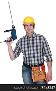 Man with a masonry drill