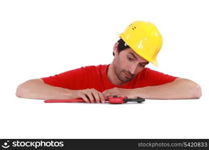 Man with a pipe wrench