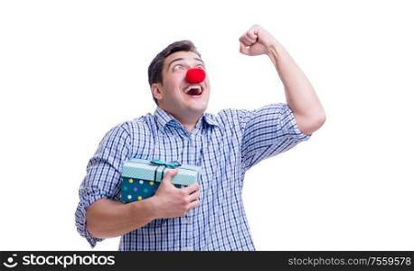 Man with a red nose funny holding a shopping bag gift present isolated on white background. Man with a red nose funny holding a shopping bag gift present is