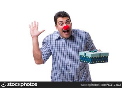 Man with a red nose funny holding a shopping bag gift present is. Man with a red nose funny holding a shopping bag gift present isolated on white background