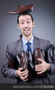 Man with a selection of shoes