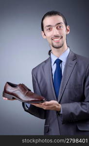 Man with a selection of shoes